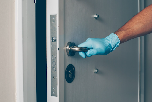 Lady Locksmith certified expert performing residential lock installation and repair service
